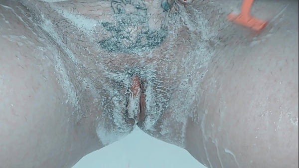 Milf shaving her pussy up close and lots of soap