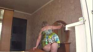 Neighbor watches chubby milf through open window. PAWG.