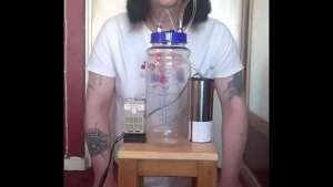 bisexual crossdresser with his portable cow milking machine