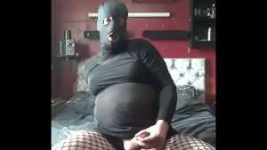 mark wright the bisexual crossdressing sissy is not cam shy as he pulls his mask of his head and puts it back on again as he shoots a cumshot towards the end but said he would have cum quicker if he had a real cock fucking him from behind