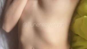 Woman massages her small clitoris