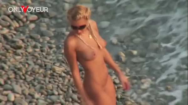 Beach Voyeur. Gorgeous blonde babe riding her man on a public beach