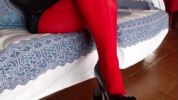 Laura on Hee step sister on sexy lingerie and high heels shoed sitted on a sofa.